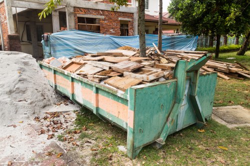 Construction site with builders removing waste
